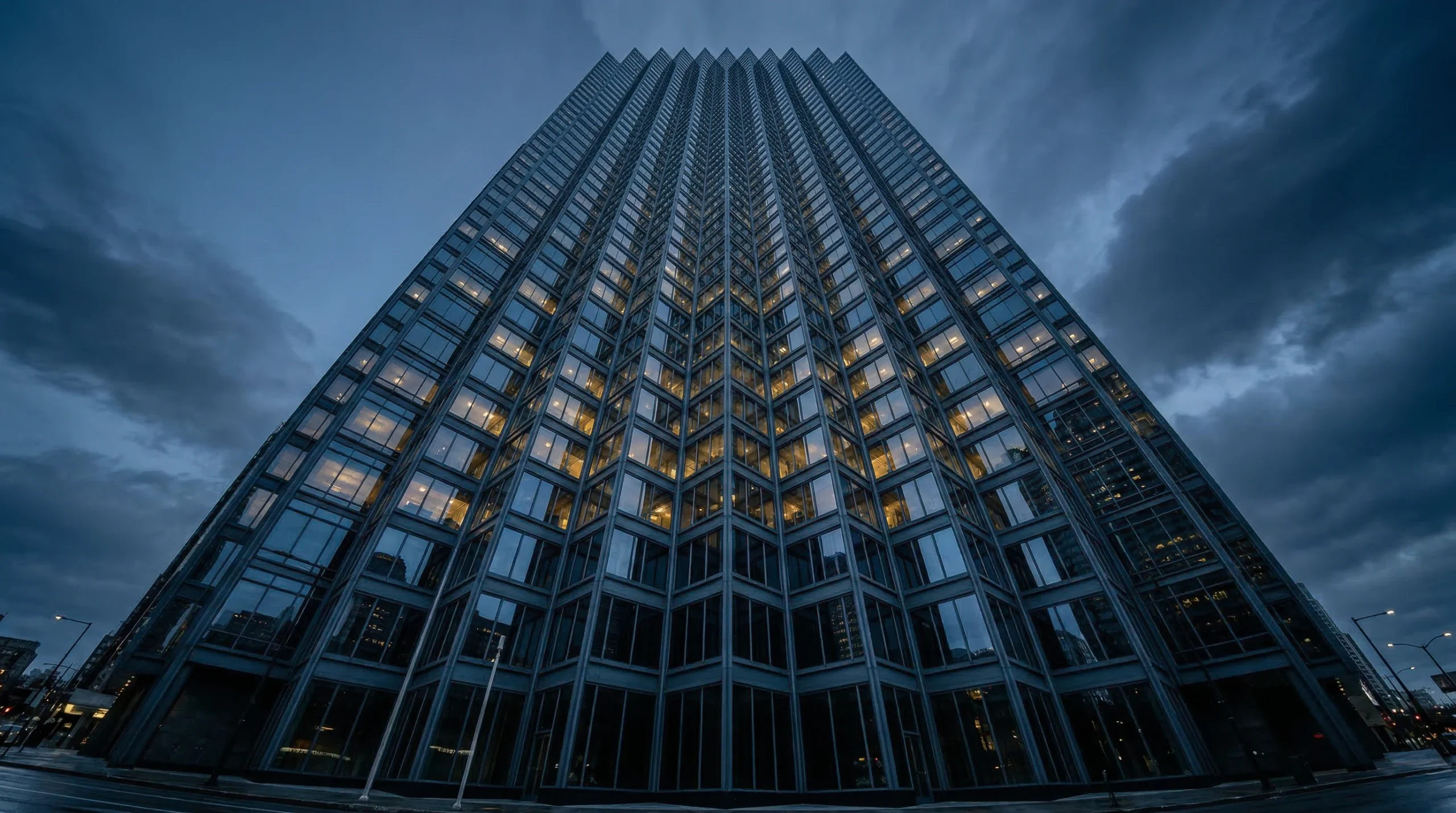 Glass Tower at Dusk with Illuminated Windows