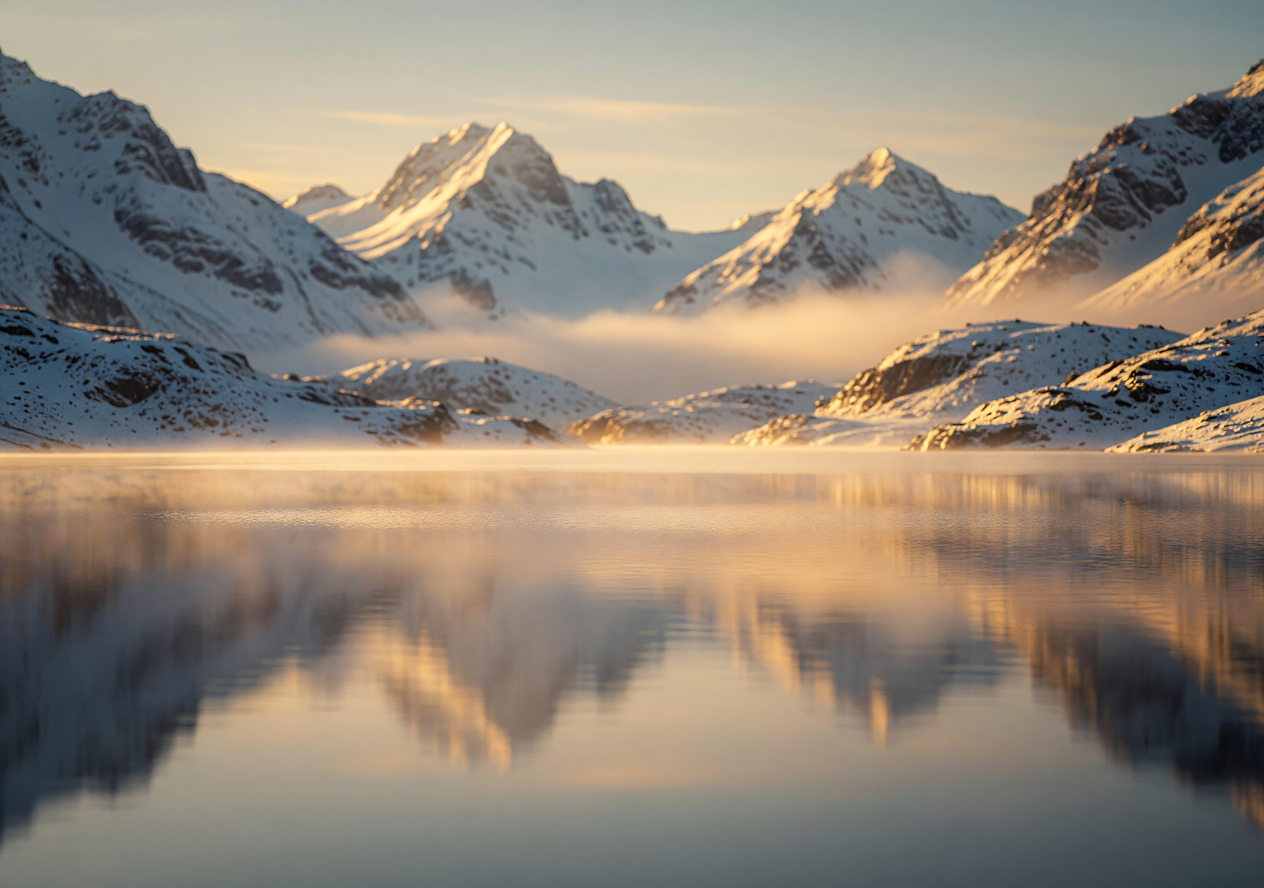 Golden Dawn Over Serene Snowy Mountain Lake