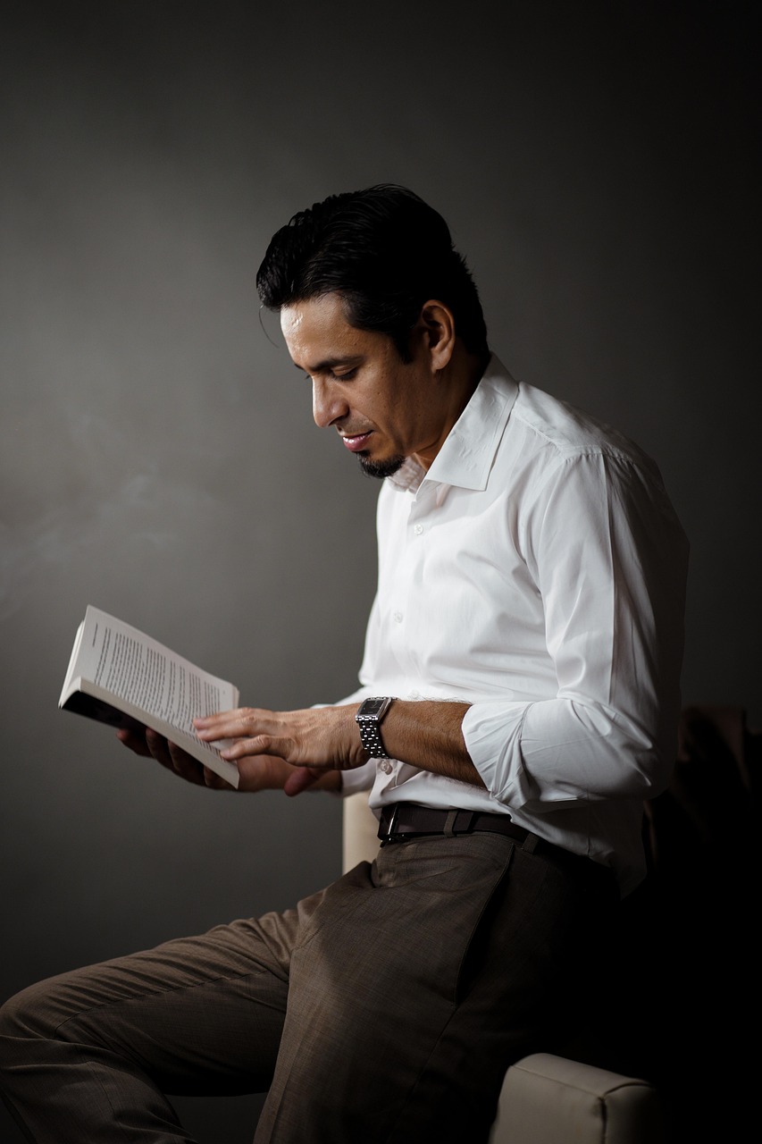 Man Reading a Book in Thoughtful Pose
