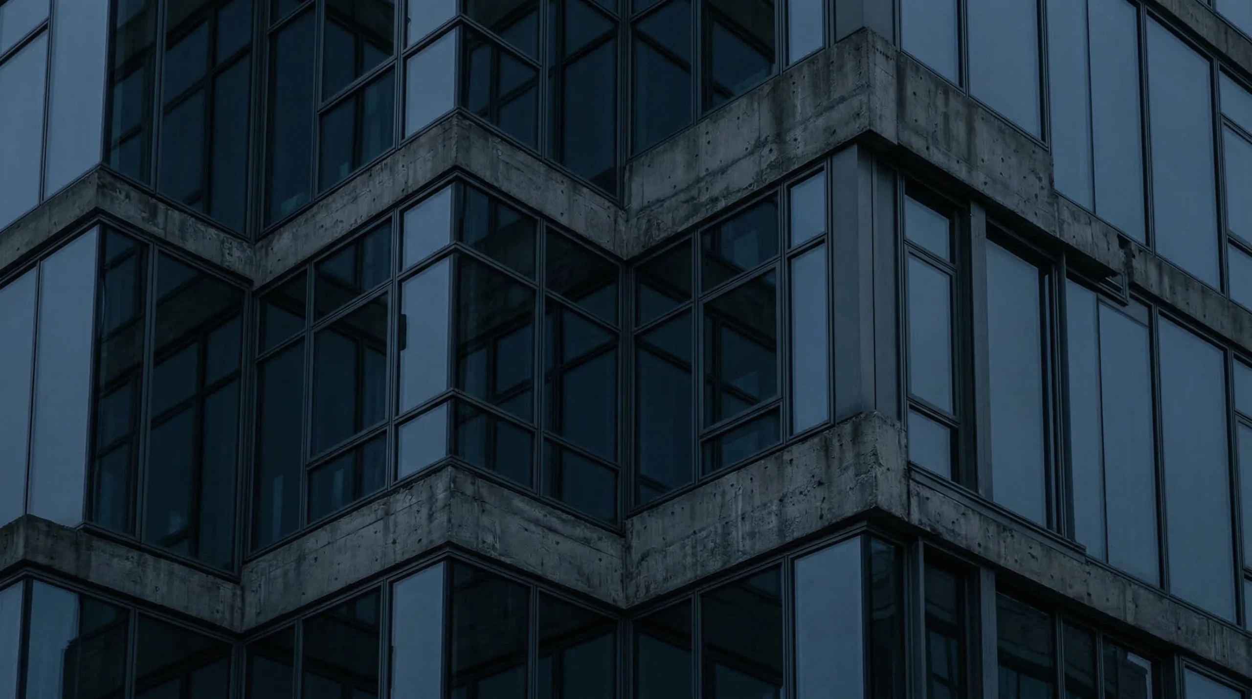 Modern Concrete and Glass Building Facade at Dusk
