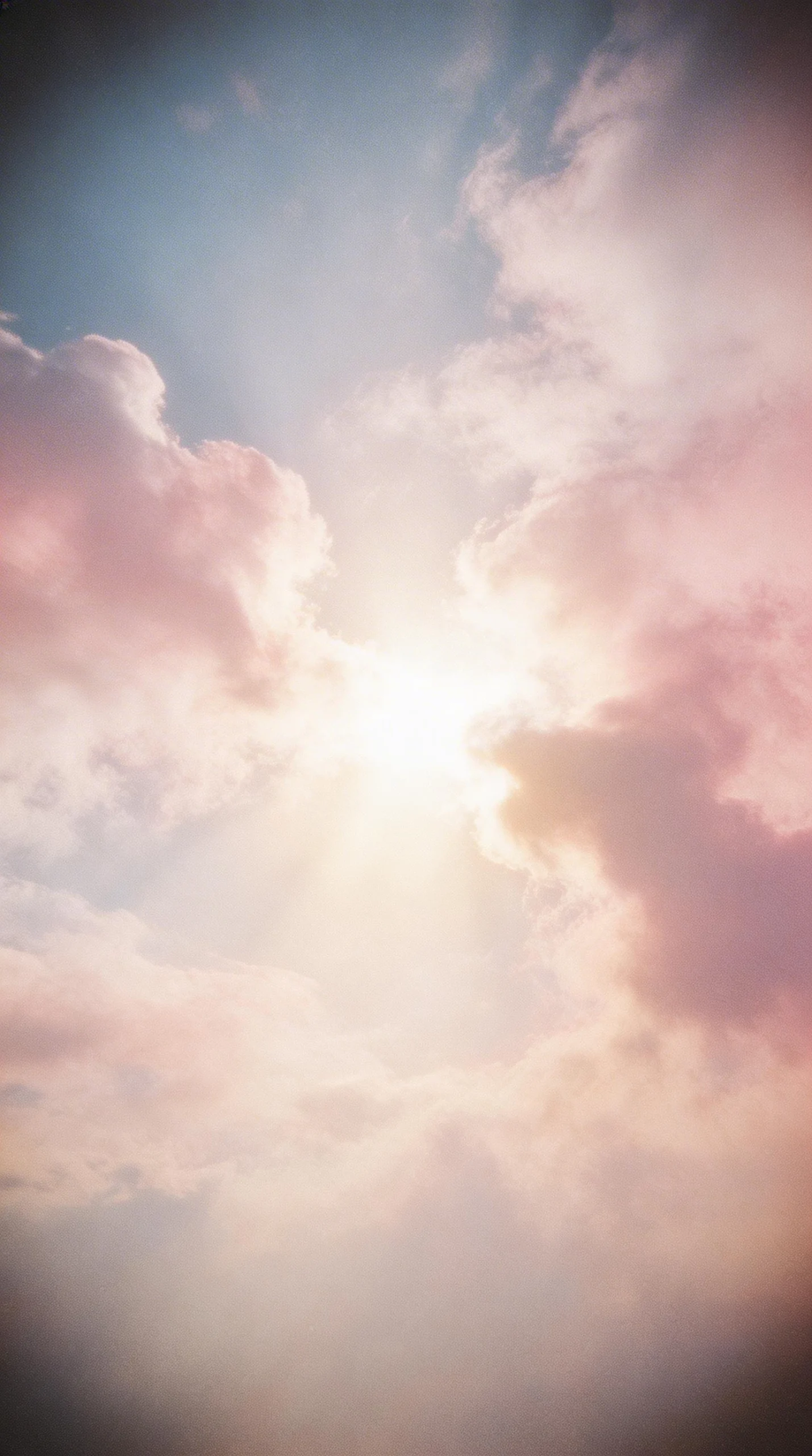 Sunlight Breaking Through Soft Pink Clouds