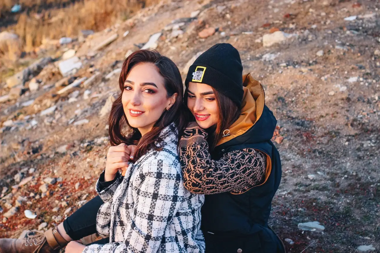 Two Friends Enjoying Outdoors in Casual Winter Wear