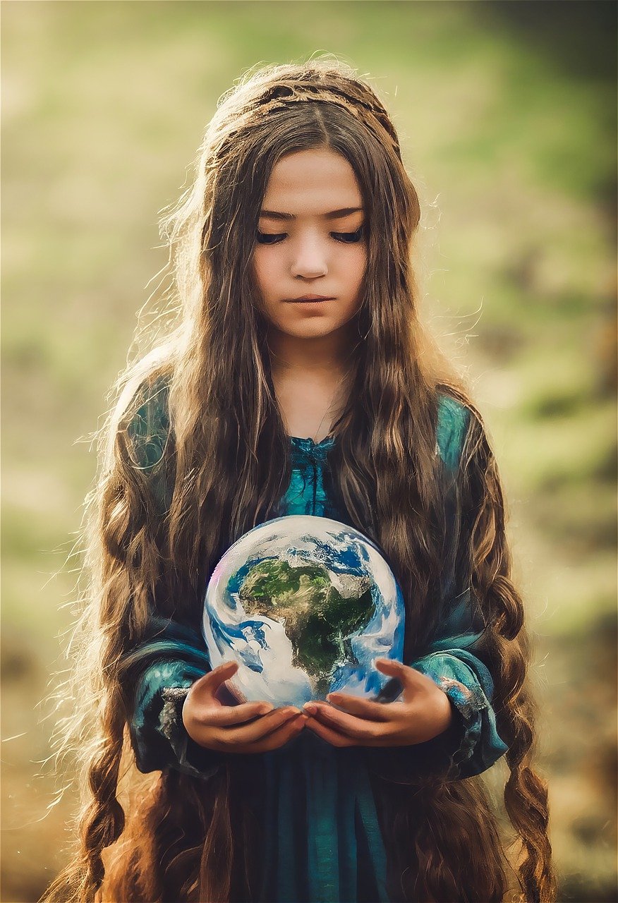 Young Girl Holding a Globe Representing Earth