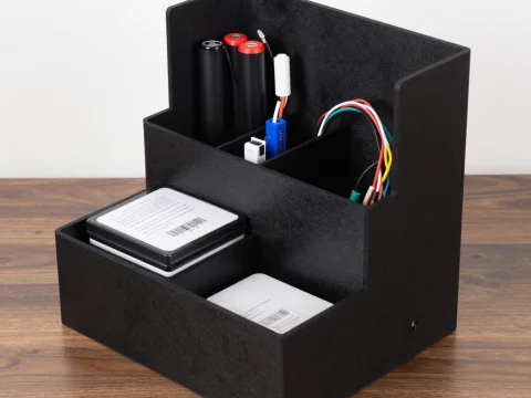 3D Printed Black Organizer with Electronic Components