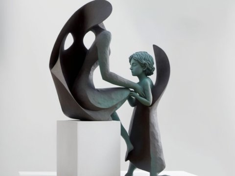 Abstract Sculpture of a Woman and Child in Embrace