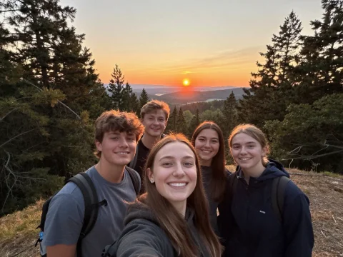 Adolescents Taking a Selfie at Sunset in the Forest