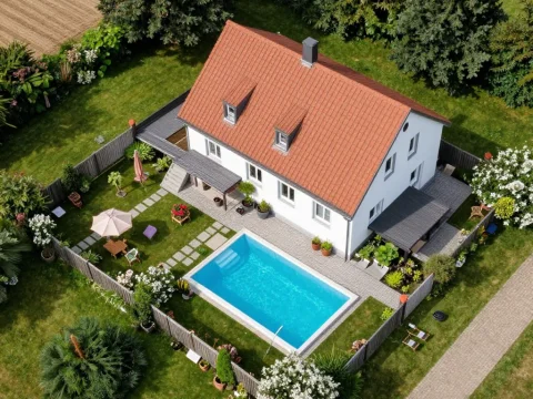 Aerial View of Cozy House with Pool and Garden