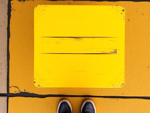Bird's Eye View of Feet on Yellow Tiled Floor
