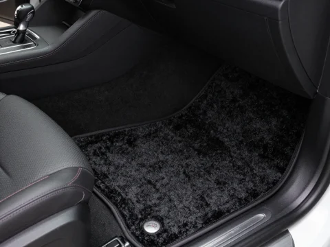 Black Plush Car Floor Mat in Modern Vehicle Interior