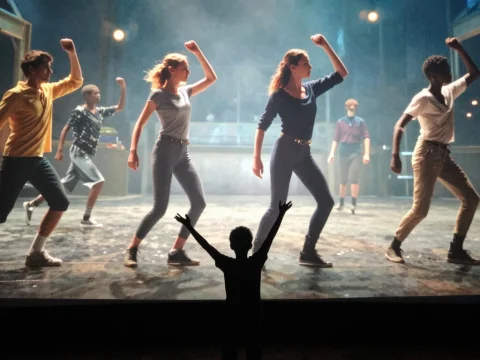 Child Watching Dance Exercise on Giant Screen