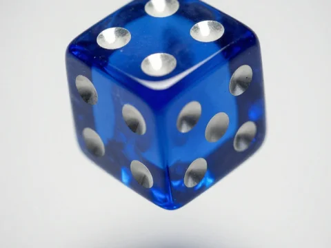 Close-up of a Floating Cobalt Blue Glass Dice