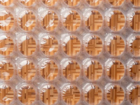 Close-up of Bubble Wrap on Wooden Surface