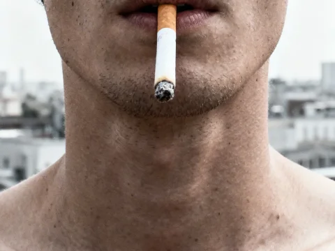Close-up of Man Smoking Cigarette