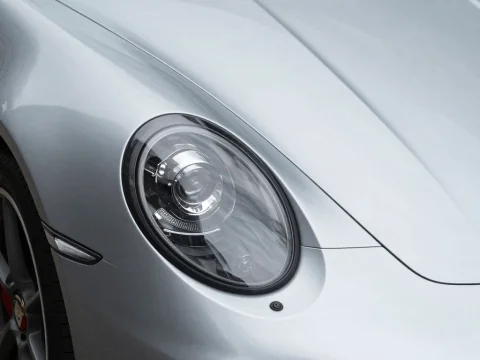 Close-up of Porsche-style Headlight on Silver Car