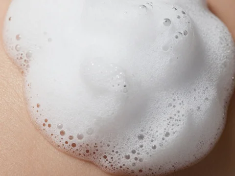 Close-up of White Clay Mousse Foam on Skin