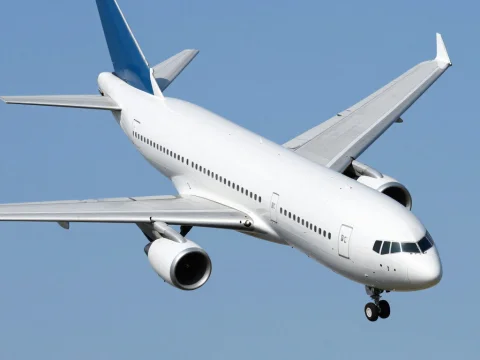Commercial DC-10 Aircraft in Flight Against Clear Sky
