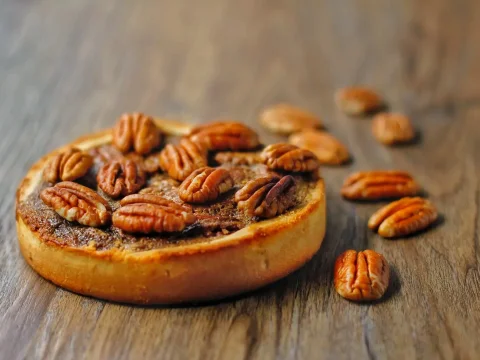 Delicious Pecan Tart on Wooden Surface