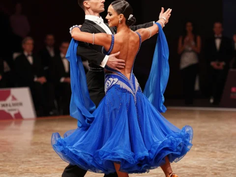 Elegant Ballroom Dance Couple in Blue Dress