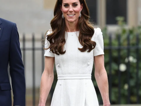 Elegant Woman in White Dress Outdoors