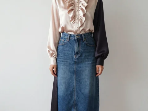 Elegant Woman Wearing Satin Ruffled Blouse and Denim Skirt