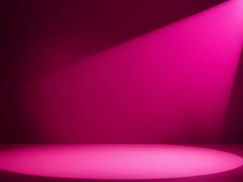 Empty Stage Illuminated by Pink Spotlight