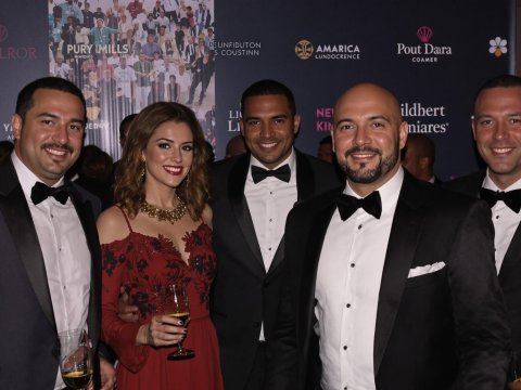 Group of Well-Dressed People at Formal Event