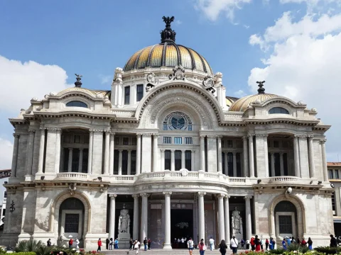 Historic Palace with Golden Dome Under Blue Sky