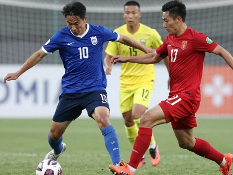 Intense Football Match Action with Players Competing for the Ball