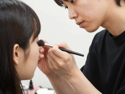 Japanese Makeup Artist Applying Makeup on Client