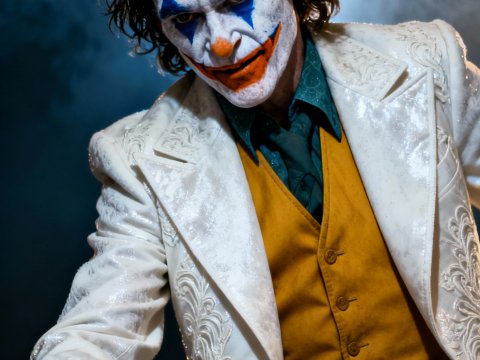Man in Detailed White Suit and Clown Makeup