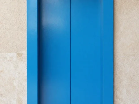 Minimalist Blue Elevator Doors in Beige Wall
