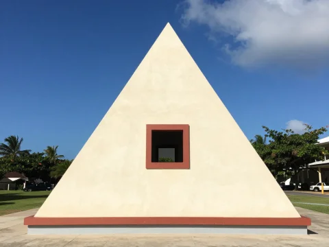 Minimalist Pyramid Structure with Central Square Window