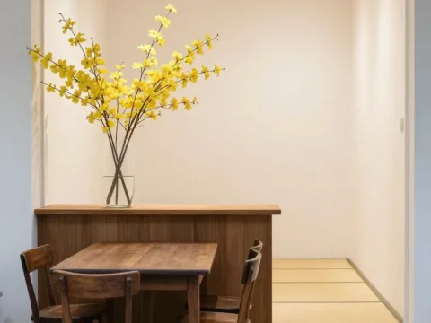 Minimalist Shop Entrance with Wooden Furniture and Yellow Flowers