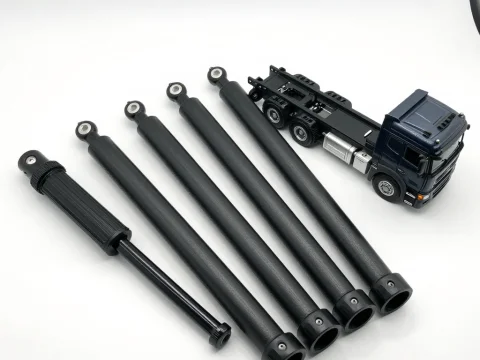 Model Truck with Shock Absorbers on White Background