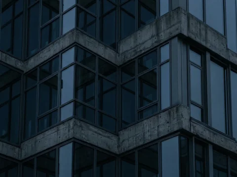 Modern Concrete and Glass Building Facade at Dusk