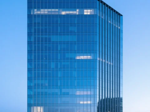 Modern Glass Skyscraper with Reflective Blue Facade