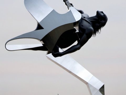 Monumental Sculpture of a Rock Guitarist in Dynamic Pose