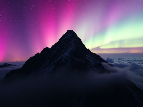 Mountain Peak Under Vibrant Northern Lights