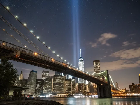Night View of Brooklyn Bridge and Manhattan Skyline with Tribute Lights