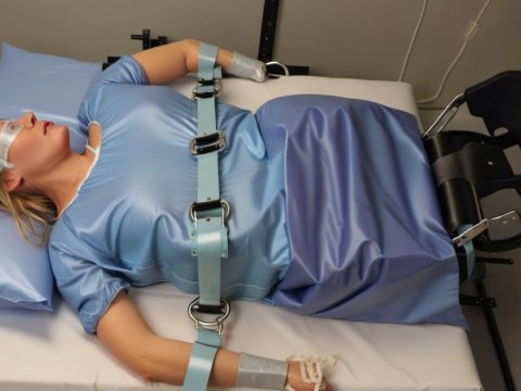 Patient Restrained on Medical Bed with Safety Straps