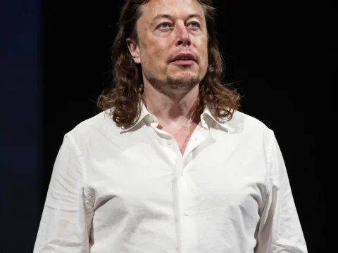 Portrait of a Man in White Shirt with Long Hair