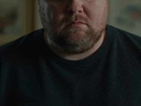 Portrait of a Tired Stocky Man in Thought