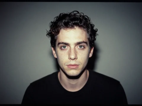 Portrait of a Young Man with Curly Hair
