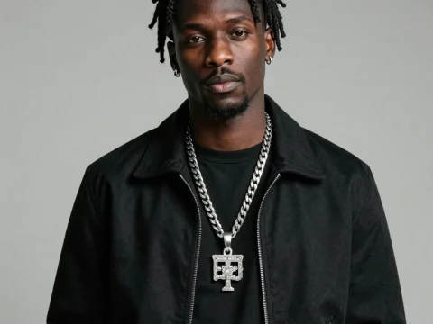 Portrait of Man Wearing Black Jacket and Silver Chain