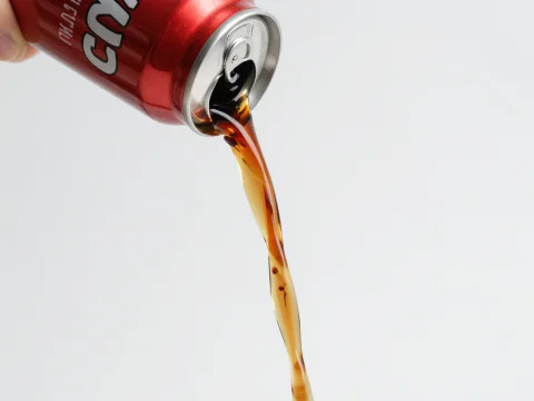 Pouring Cola from a Red Can