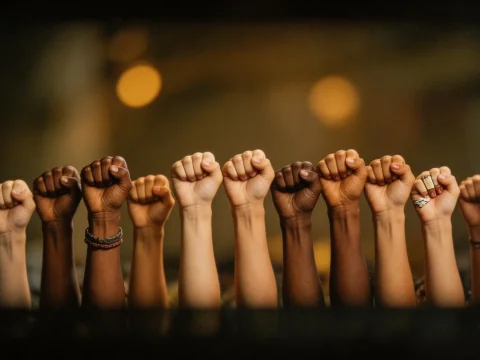 Raised Fists Symbolizing Unity and Strength