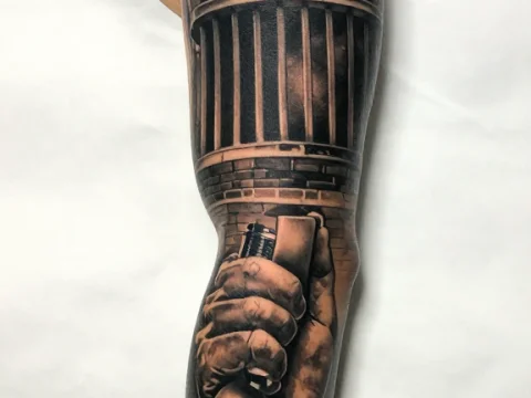 Realistic Tattoo of a Jail Building and Handcuffed Hand