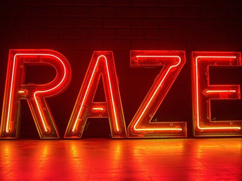 Red Neon Sign Spelling RAZE