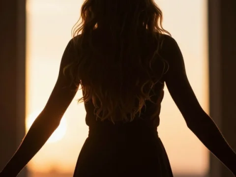 Silhouette of a Woman at Sunset