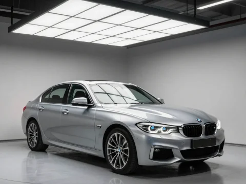 Silver BMW Sedan in Modern Garage